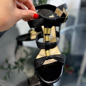 Fierce, rare find! Jimmy Choo caged ribbed leather sandals with brass accents.